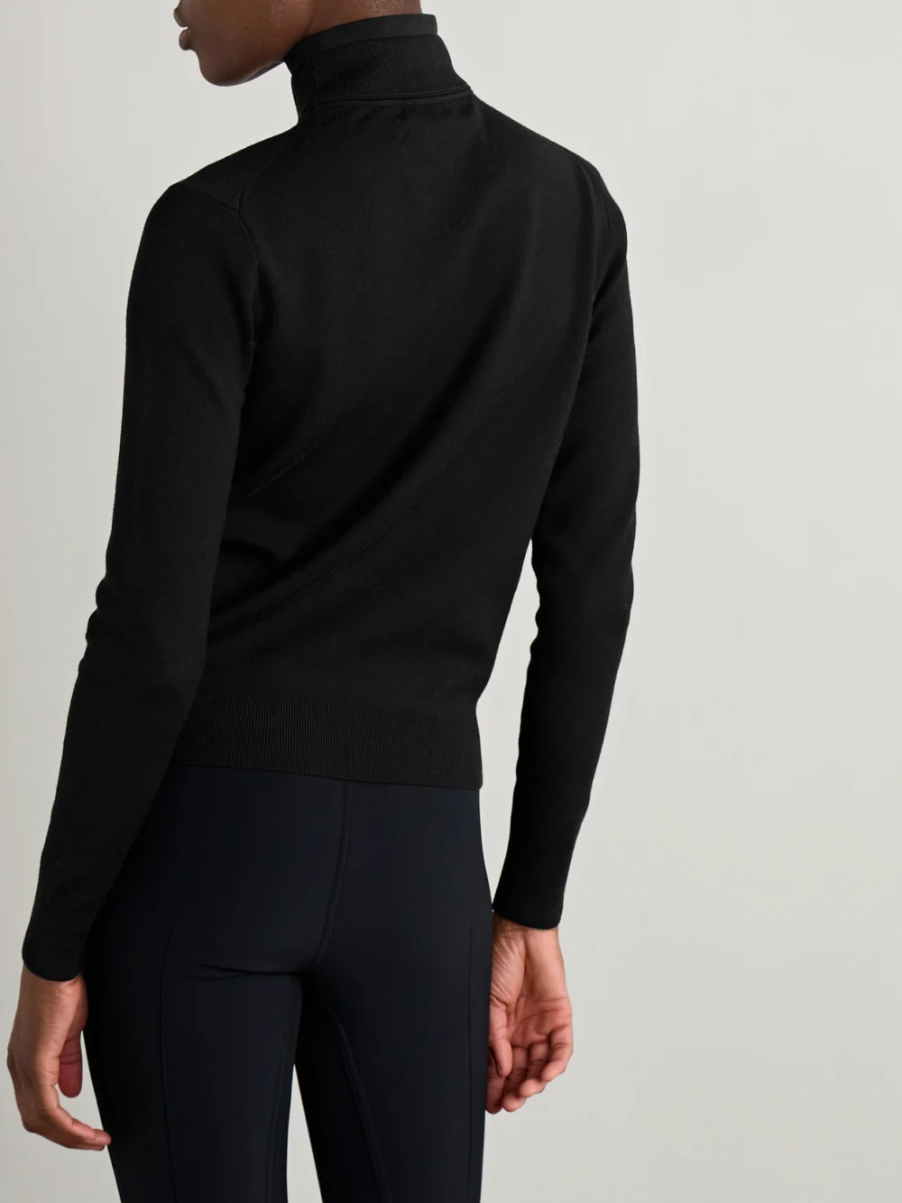Back view of the Aztech Mountain Etta Layered Jersey-trimmed Wool-blend Turtleneck Sweater