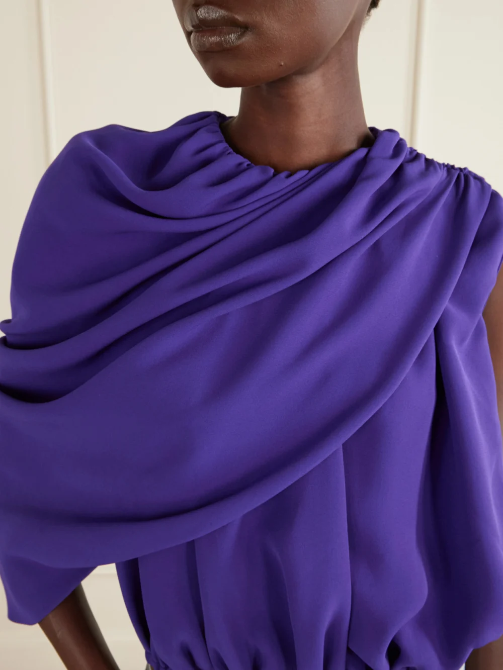 Close-up detail of the Balenciaga Asymmetrical Draped Silk Top