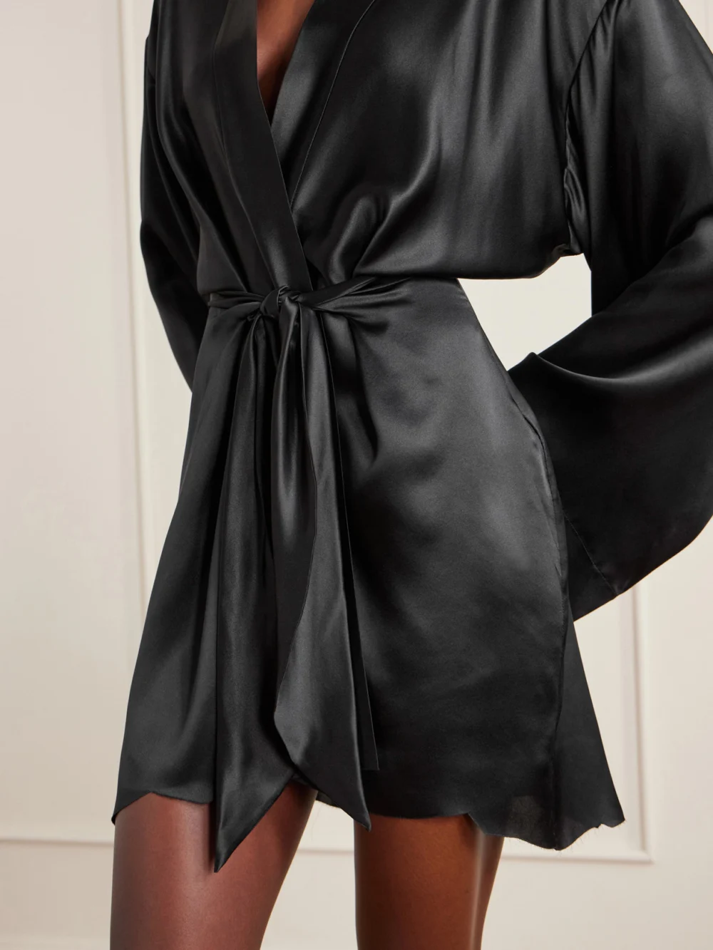 Close-up detail of the Balenciaga Belted Silk-satin Mini Wrap Dress