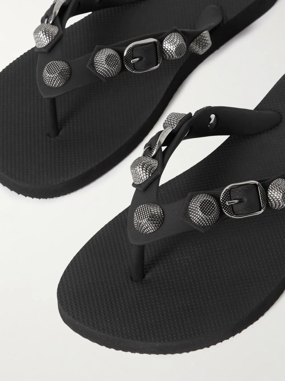 Close-up detail of the Balenciaga Cagole Embellished Rubber Flip Flops