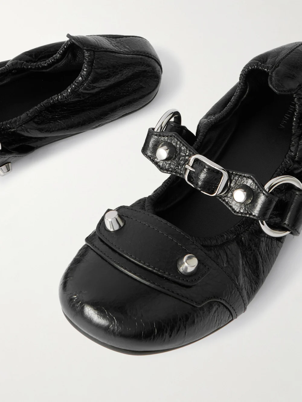 Close-up detail of the Balenciaga City Embellished Crinkled-leather Ballet Flats
