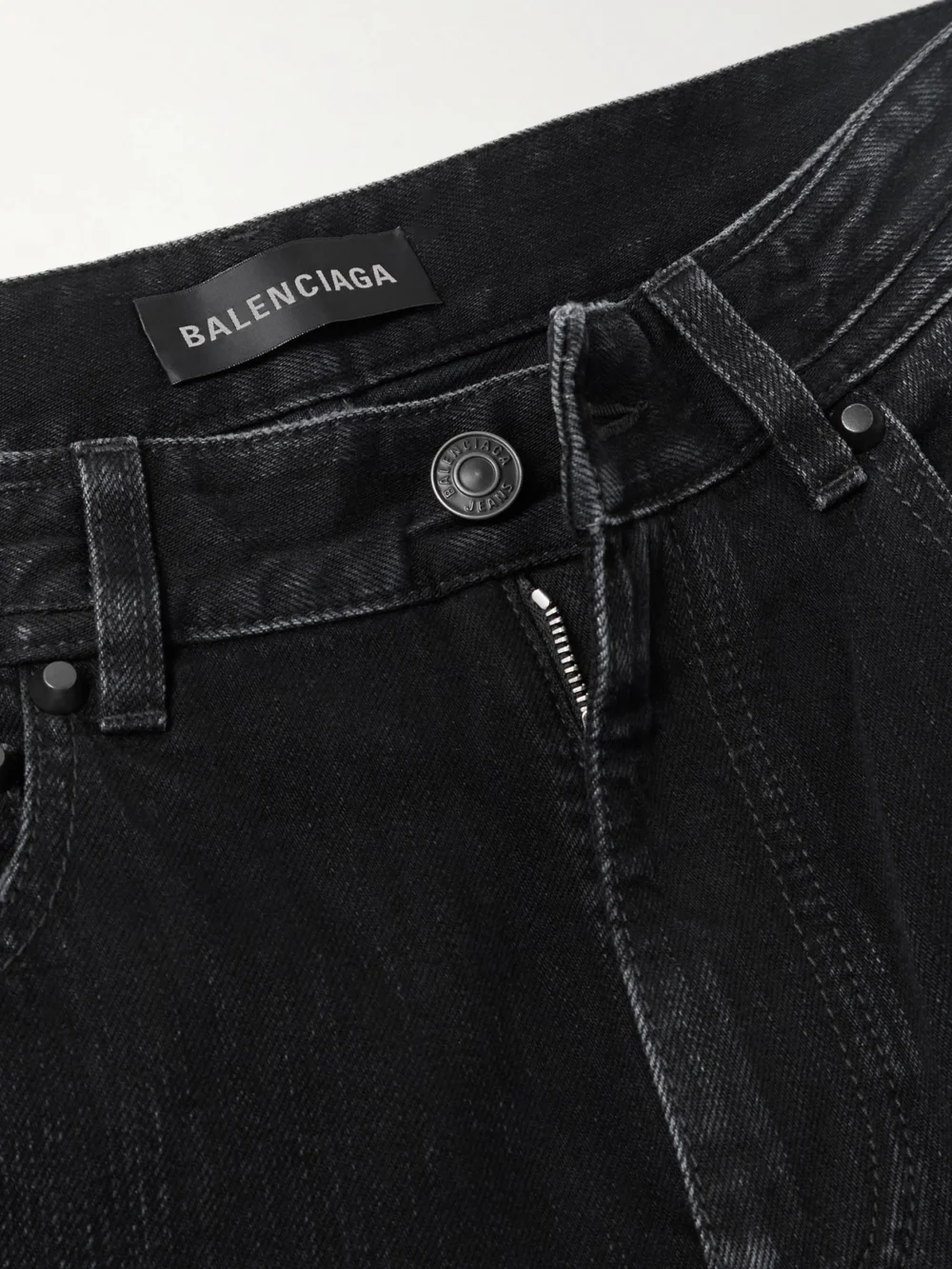 Close-up detail of the Balenciaga City Studded Low-rise Straight-leg Jeans