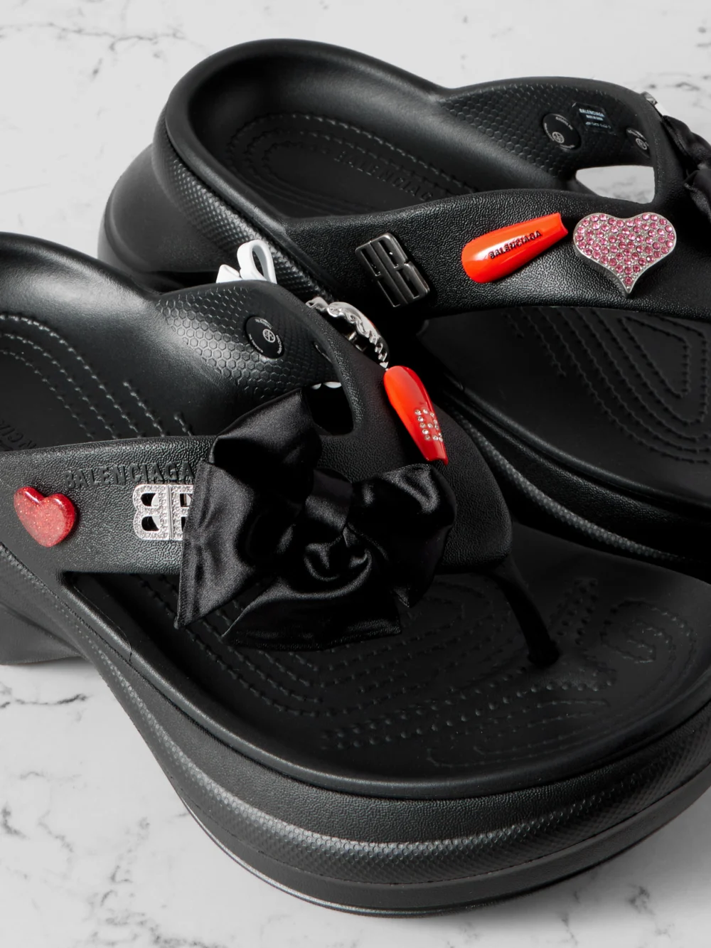 Close-up detail of the Balenciaga + Crocs™ Embellished Rubber Platform Flip Flops