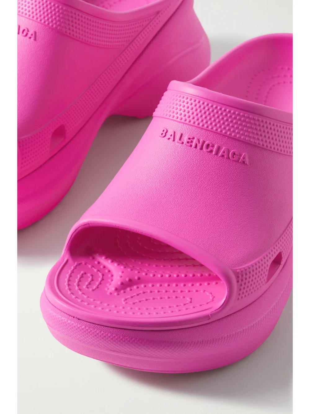Close-up detail of the Balenciaga + Crocs Pool Perforated Neon Rubber Slides