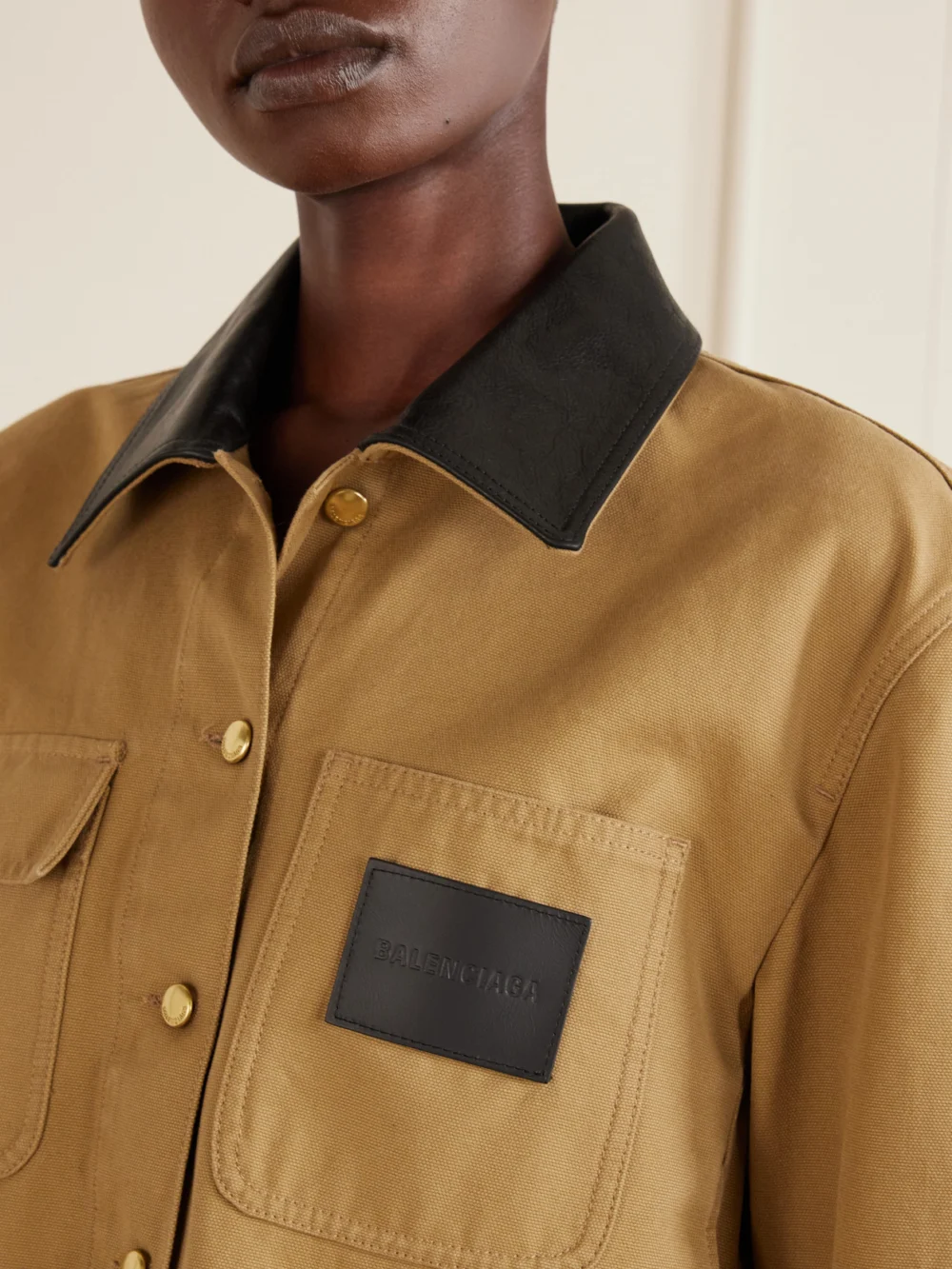 Close-up detail of the Balenciaga Cropped Leather-trimmed Cotton-canvas Jacket