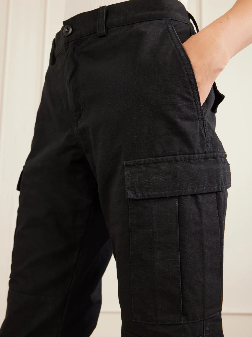 Close-up detail of the Balenciaga Cropped Paneled Cotton-ripstop Flared Cargo Pants