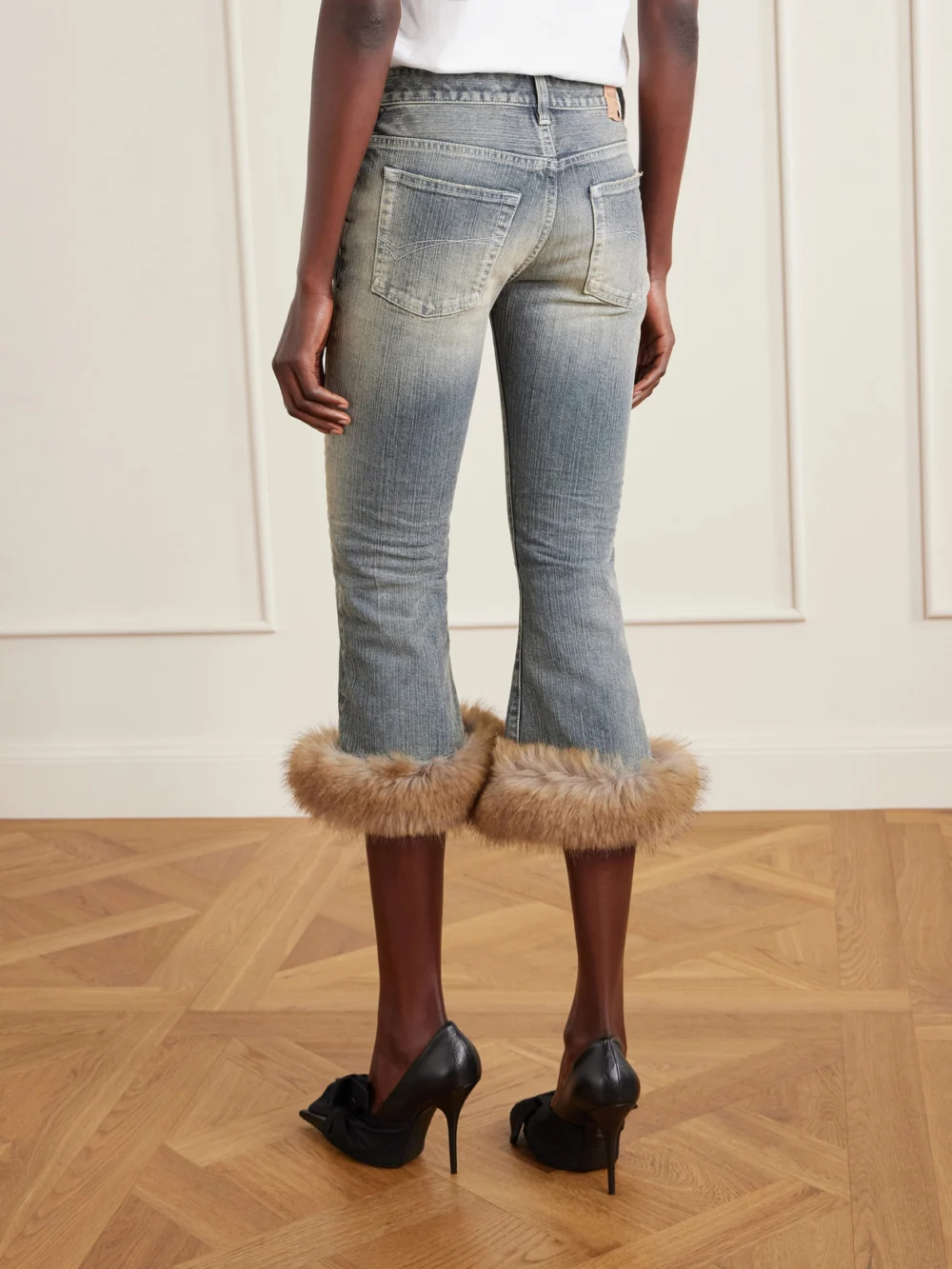 Back view of the Balenciaga Cropped Plush-trimmed Low-rise Flared Jeans