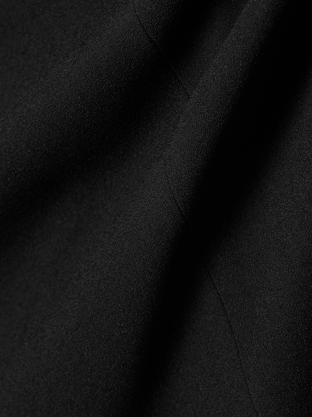 Close-up detail of the Balenciaga Draped Wrap-effect Crepe Midi Skirt
