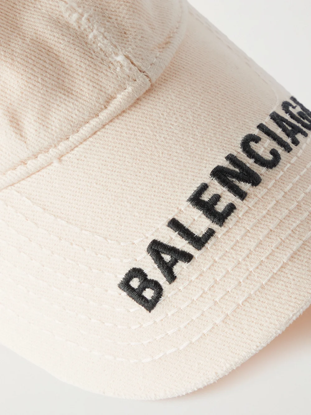 Close-up detail of the Balenciaga Embroidered Distressed Cotton-twill Baseball Cap