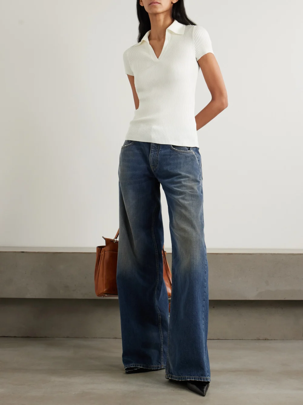 Balenciaga Embroidered Ribbed Wool-blend Polo Shirt, worn by a model