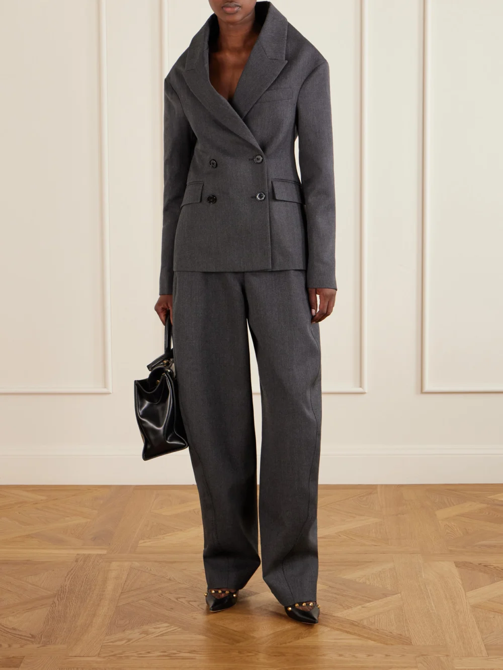 Balenciaga High-waist Barrel-leg Wool Pants, worn by a model