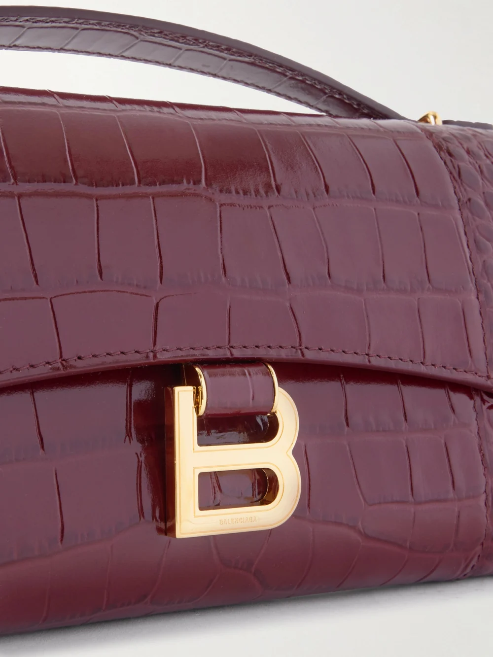 Close-up detail of the Balenciaga Hourglass Croc-effect Patent-leather Shoulder Bag