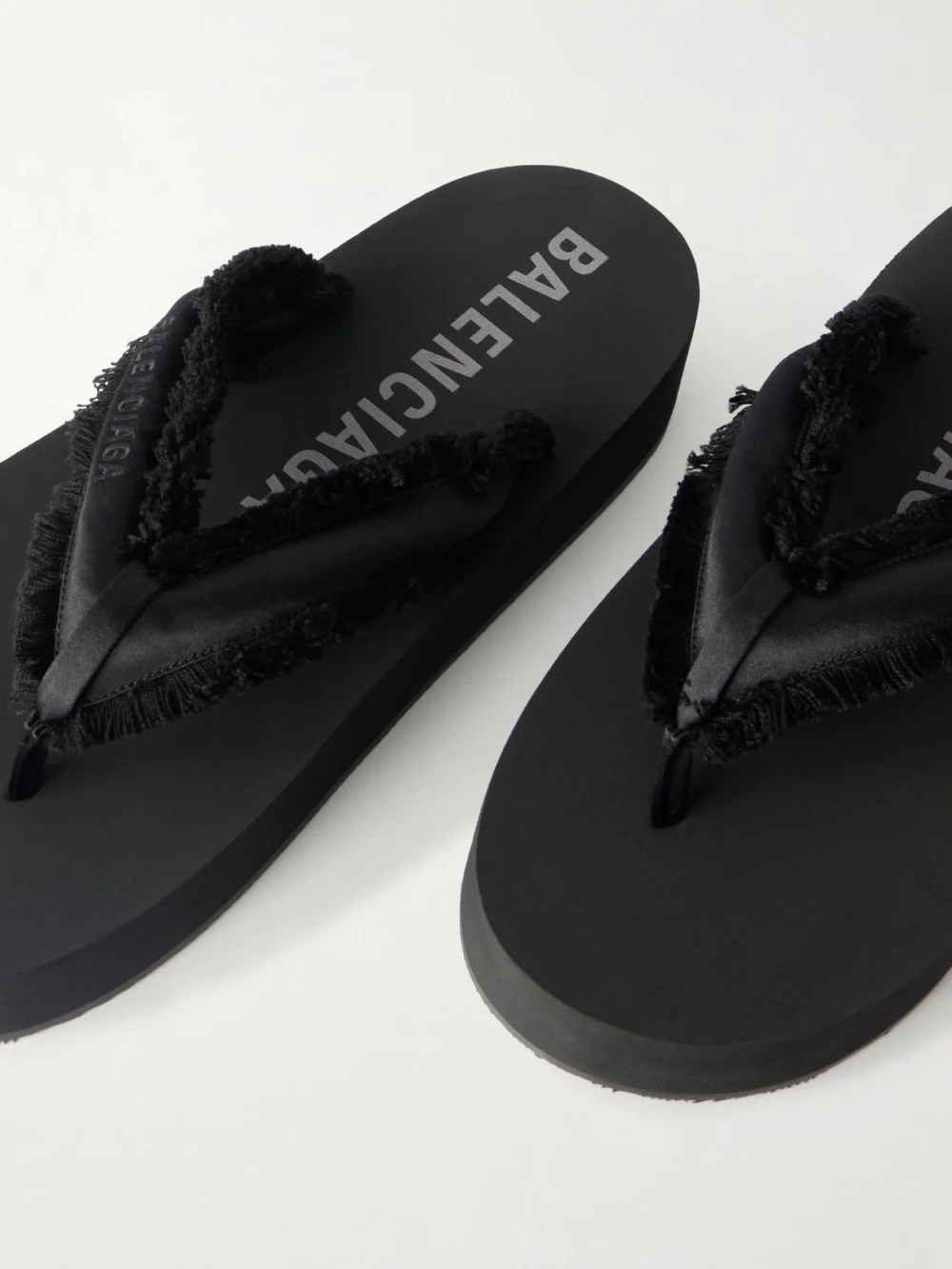Close-up detail of the Balenciaga Jet Lag Frayed Satin Thong Sandals