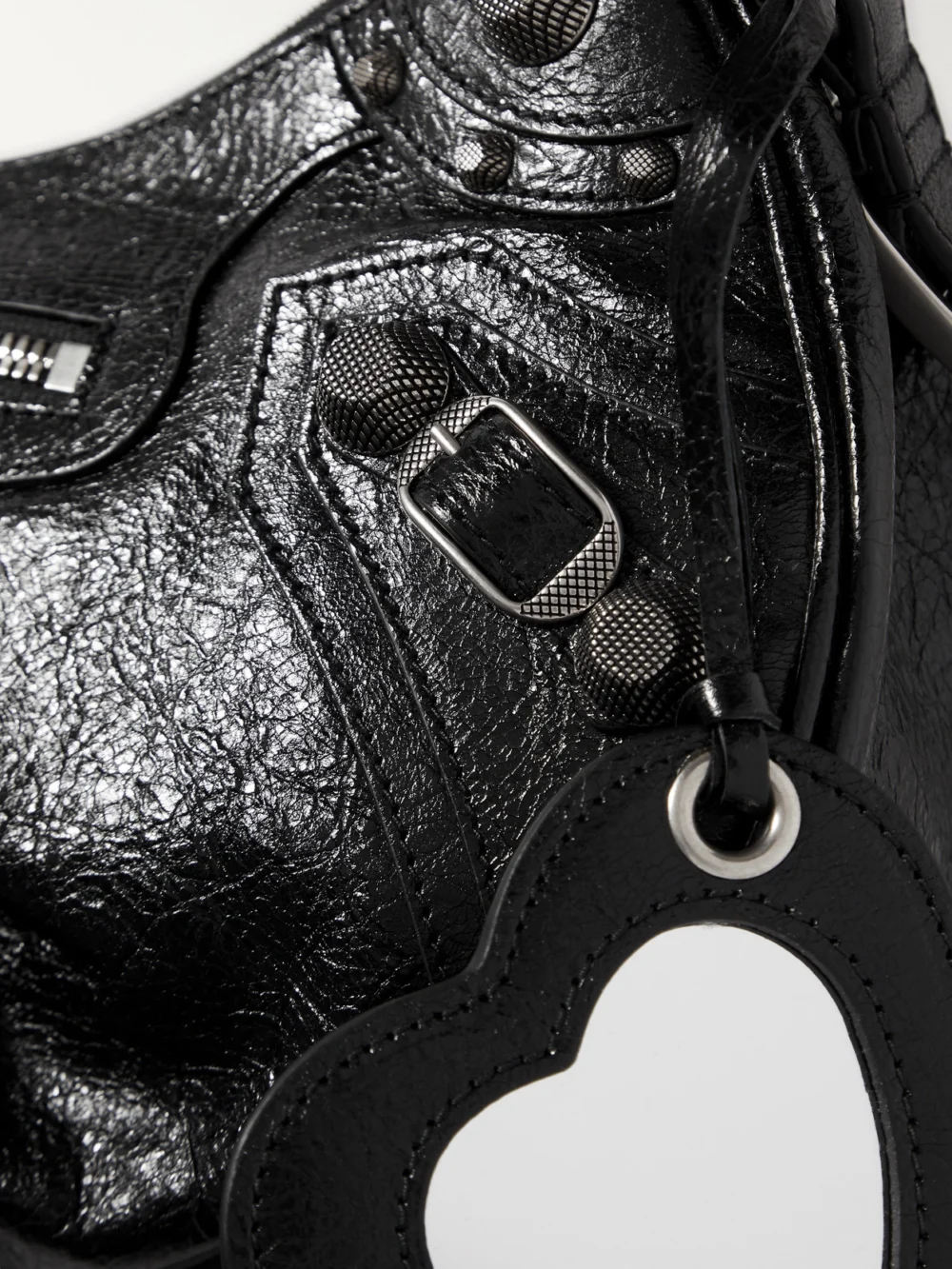 Close-up detail of the Balenciaga Le Cagole Small Studded Crinkled-leather Shoulder Bag