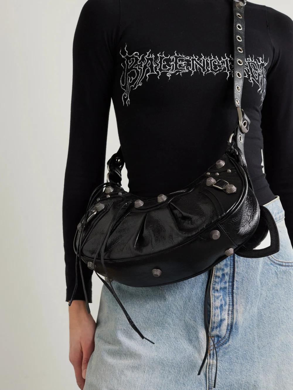 Balenciaga Le Cagole Small Studded Crinkled-leather Shoulder Bag, styled view