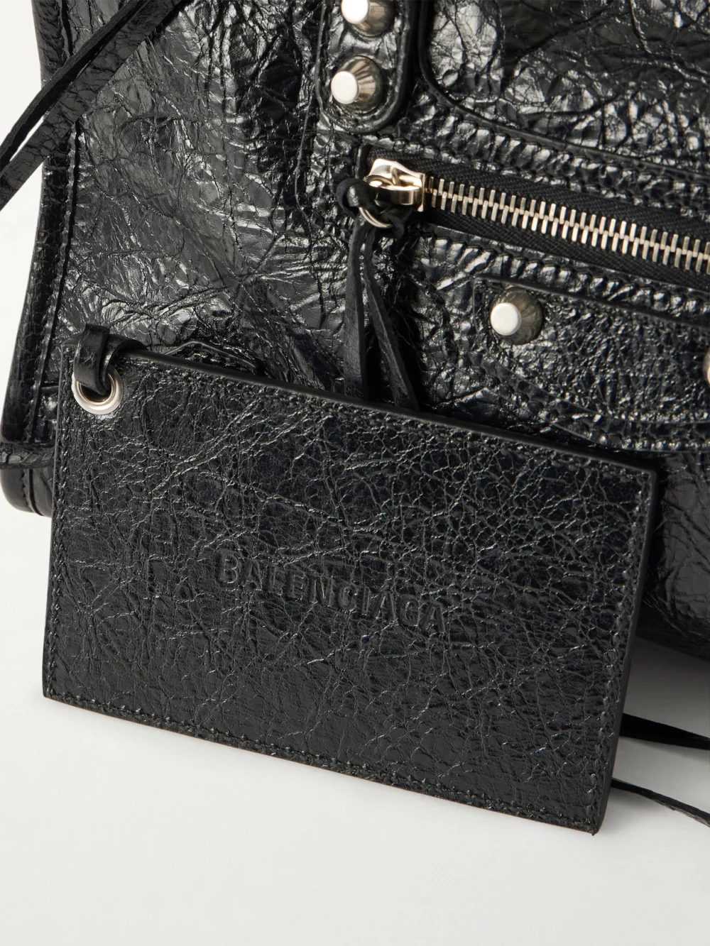 Close-up detail of the Balenciaga Le City Crinkled Glossed-leather Shoulder Bag