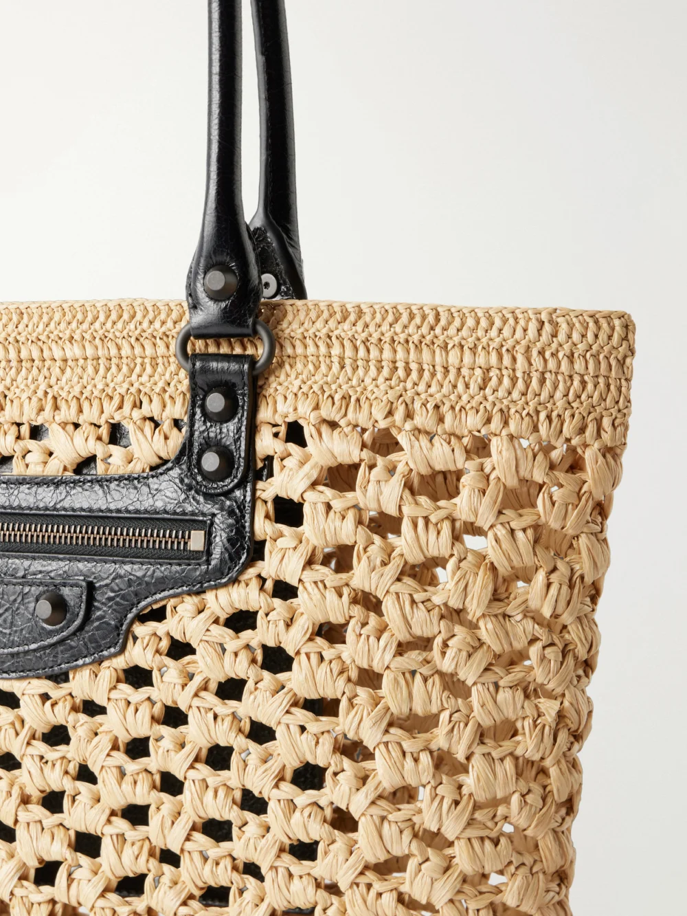 Close-up detail of the Balenciaga Le City Leather-trimmed Raffia Shoulder Bag