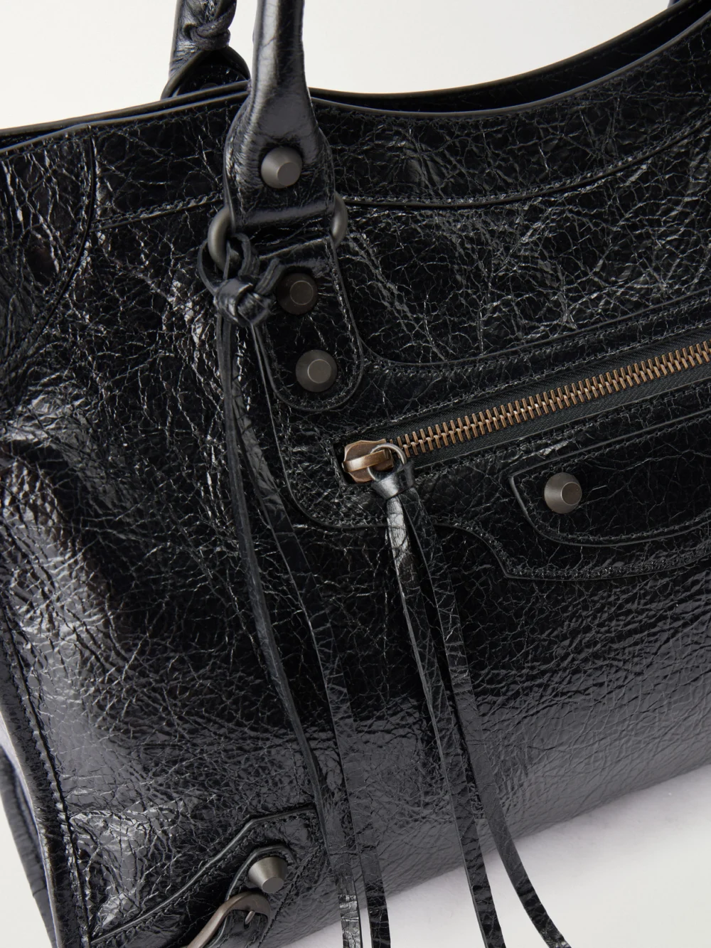 Close-up detail of the Balenciaga Le City Medium Embellished Crinkled-leather Shoulder Bag