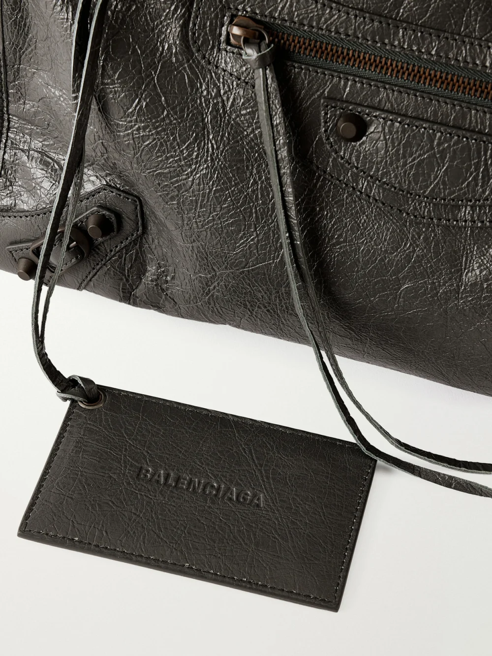 Close-up detail of the Balenciaga Le City Medium Embellished Crinkled-leather Shoulder Bag
