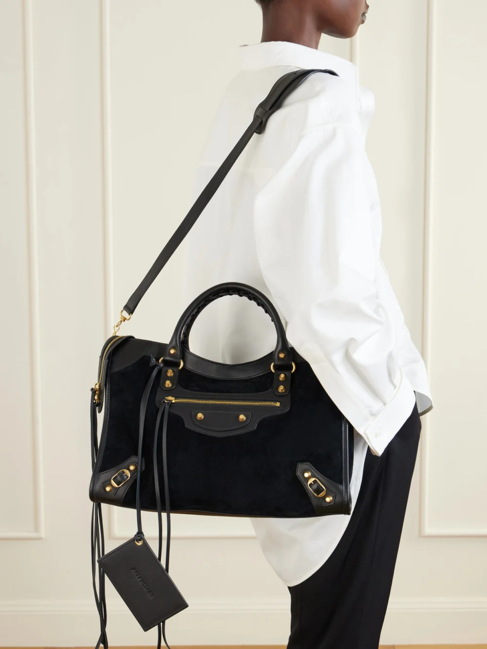 Balenciaga Le City Studded Leather-trimmed Suede Shoulder Bag, styled view