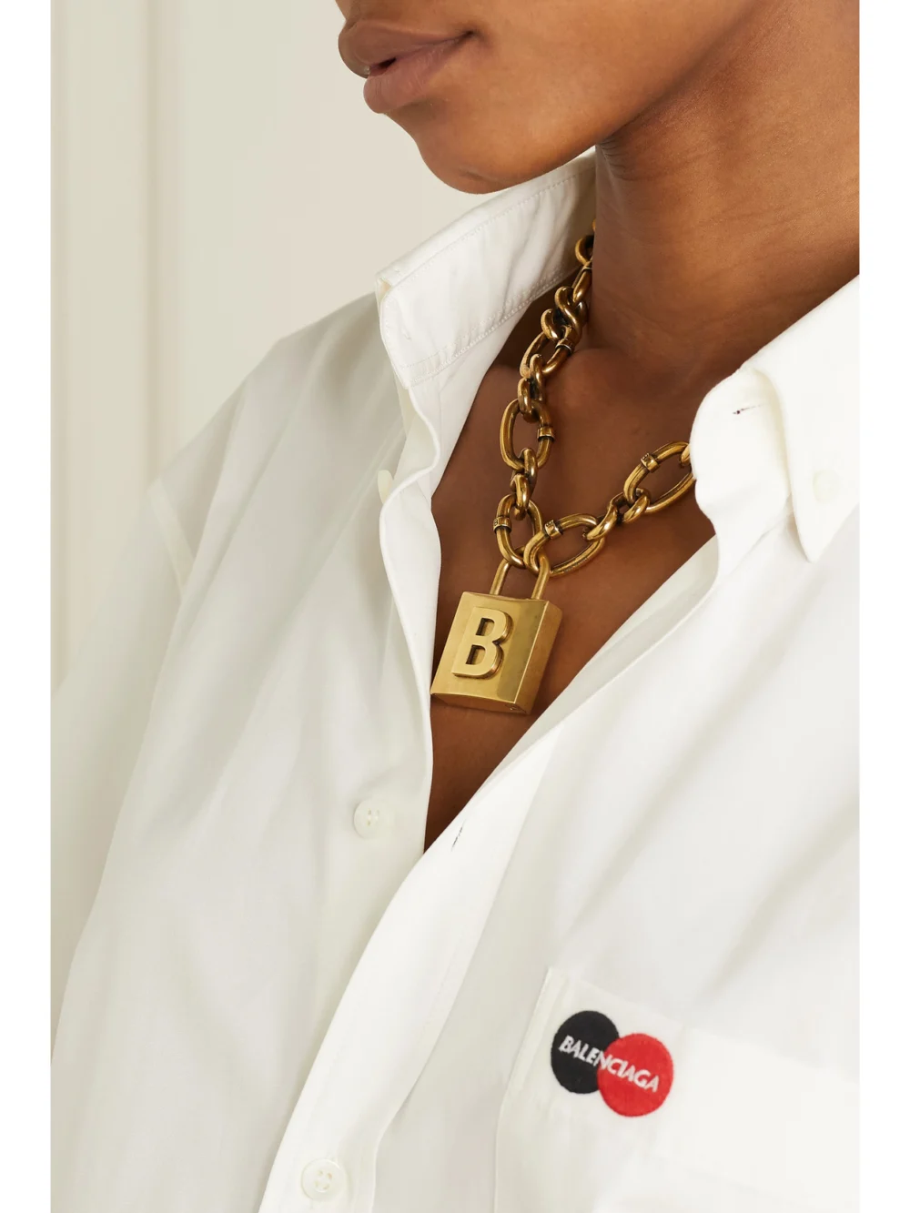 Balenciaga Lock Embossed Gold-tone Necklace, styled view