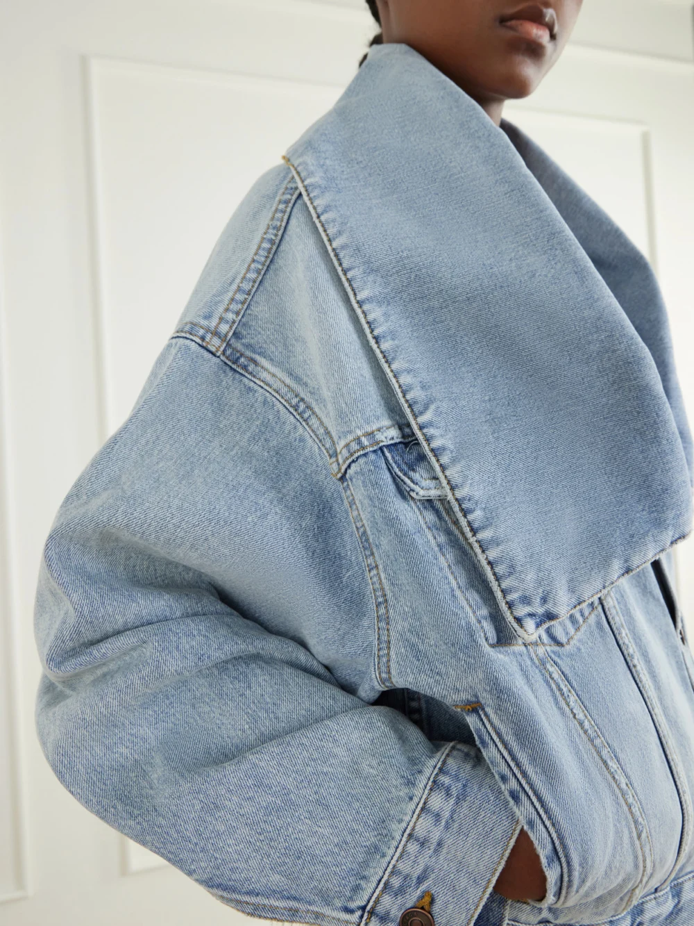 Close-up detail of the Balenciaga Oversized-collar Cropped Denim Jacket