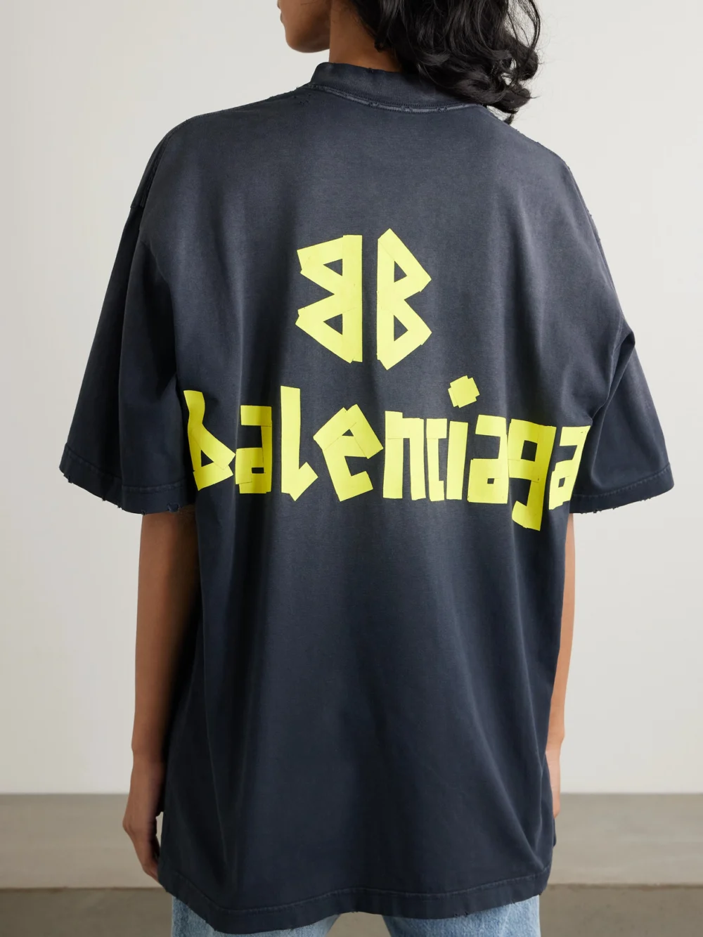 Back view of the Balenciaga Oversized Distressed Printed Cotton-jersey T-shirt