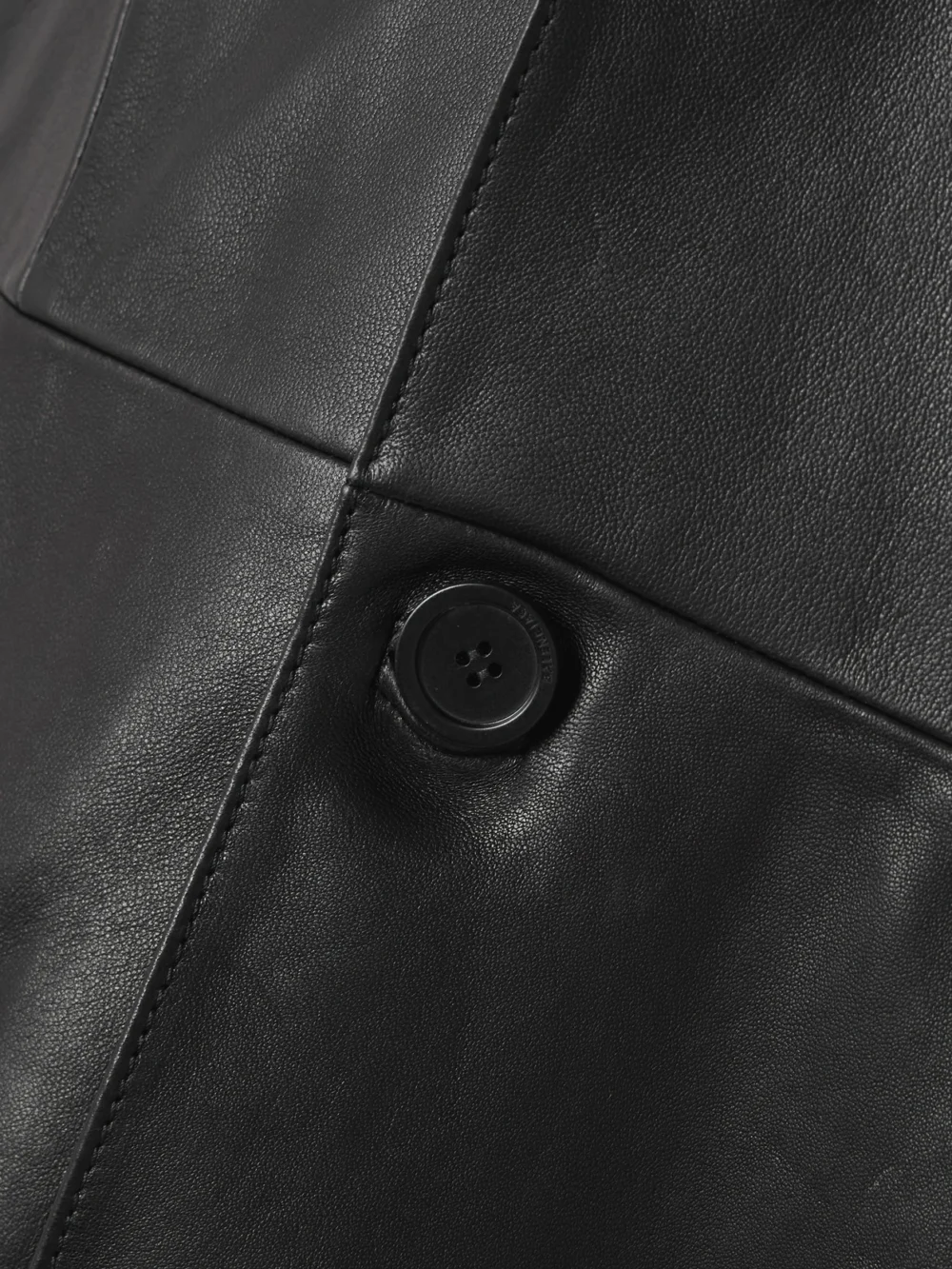 Close-up detail of the Balenciaga Paneled Leather Coat
