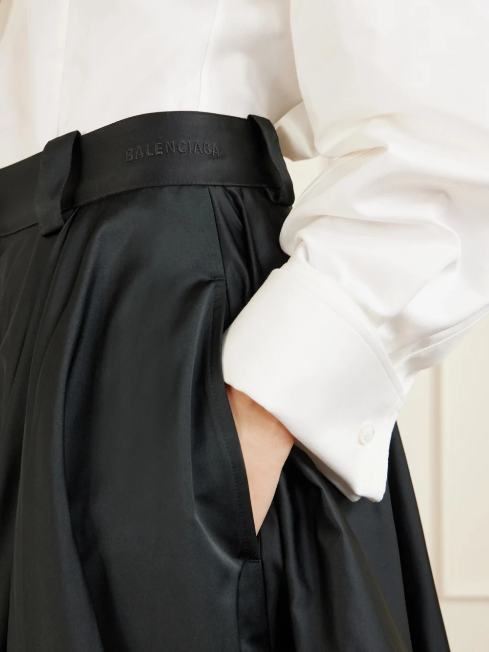 Close-up detail of the Balenciaga Pleated Satin Shorts