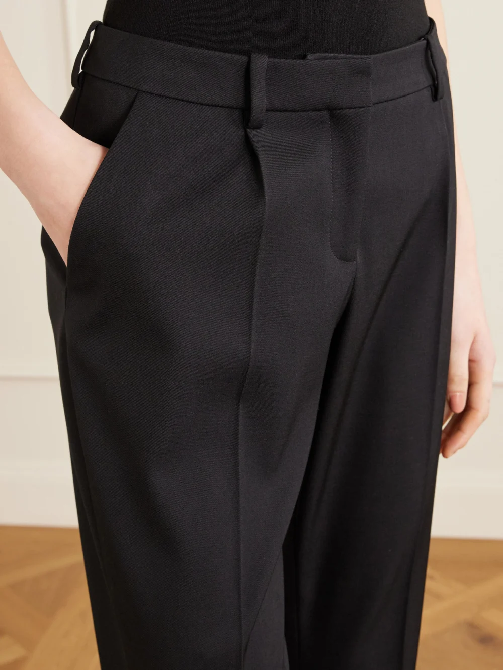Close-up detail of the Balenciaga Pleated Stretch-wool Straight-leg Pants