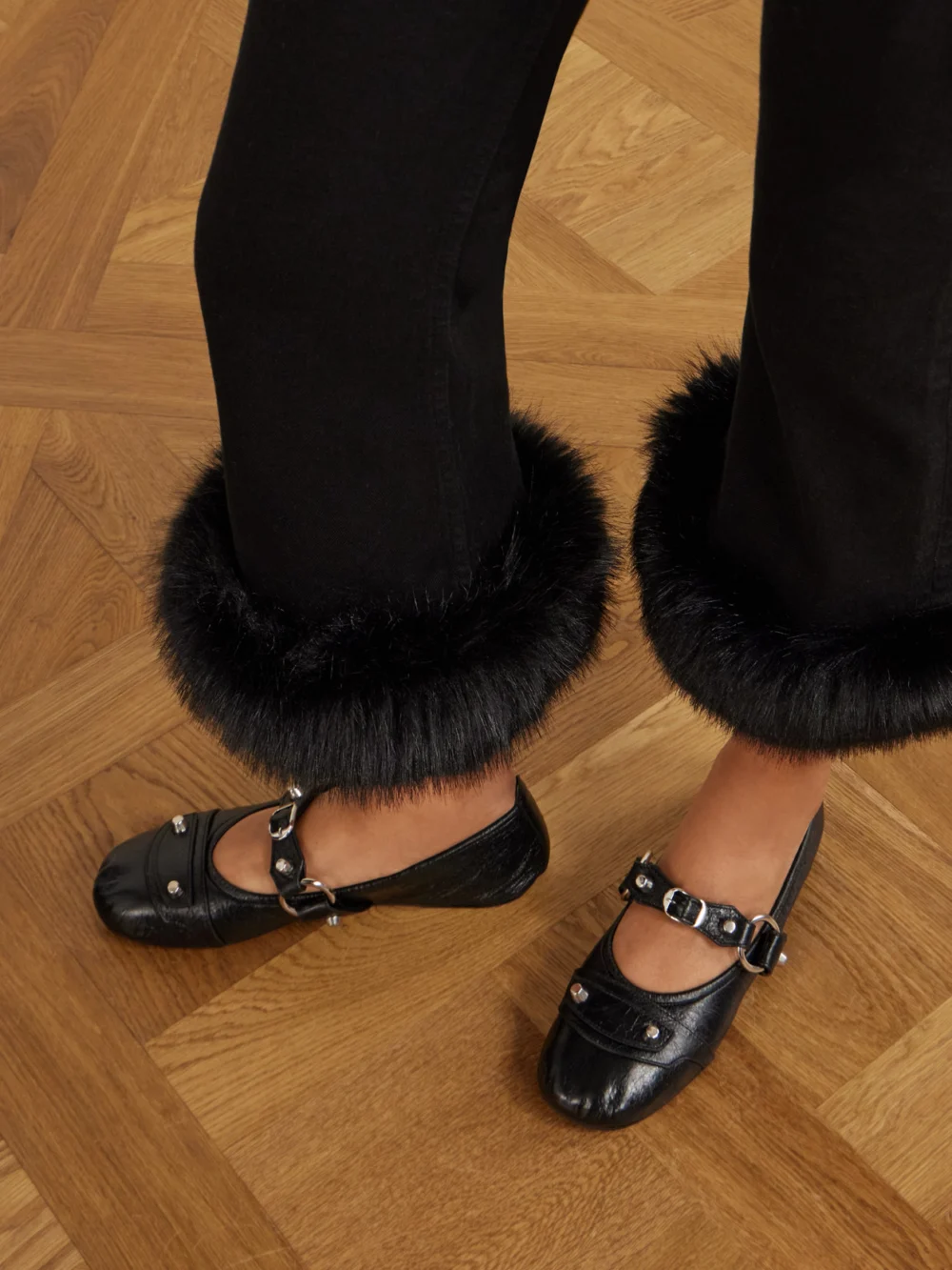 Close-up detail of the Balenciaga Plush-trimmed Cropped Mid-rise Flared Jeans