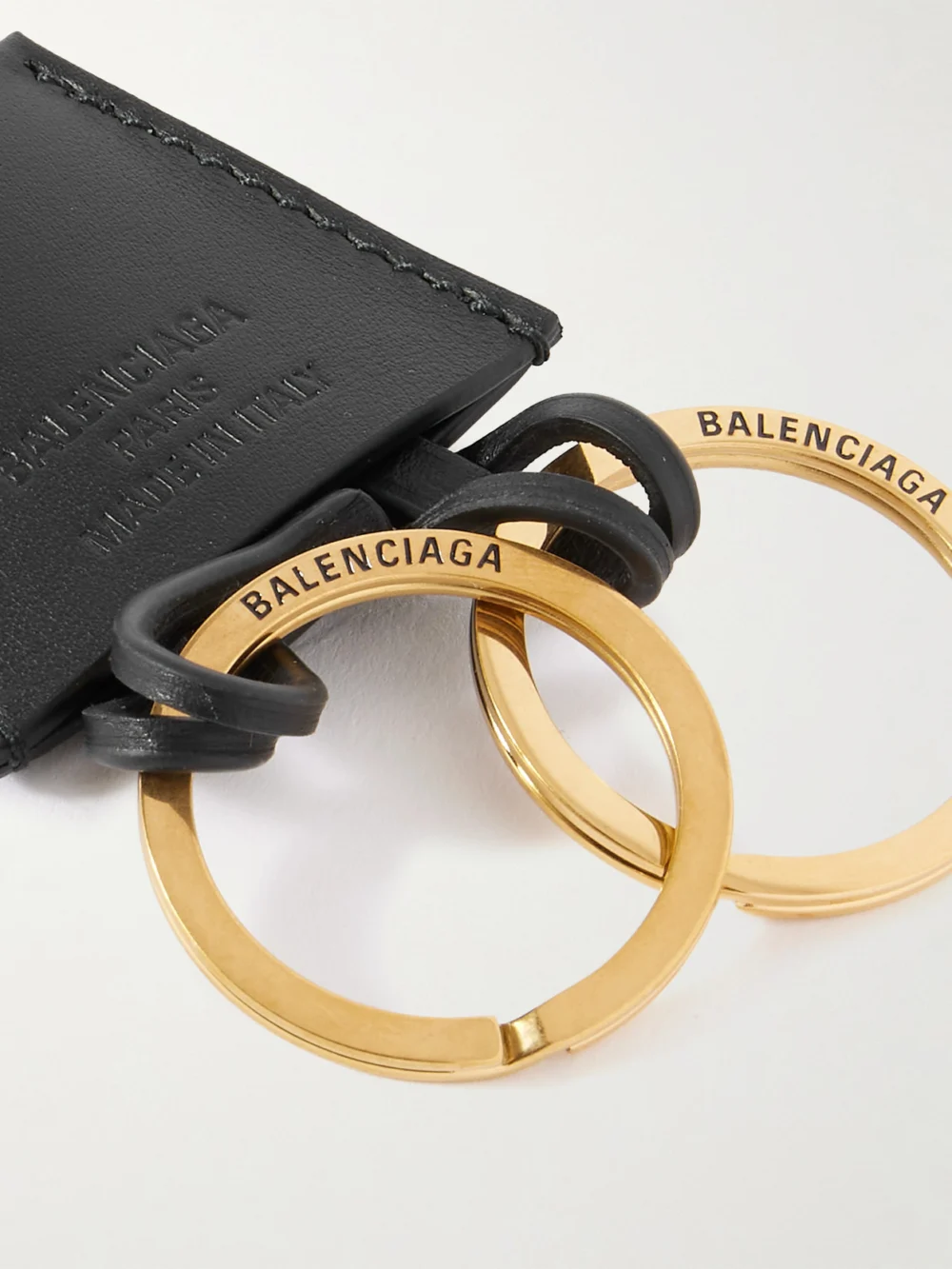 Close-up detail of the Balenciaga Rodeo Cloche Clé Gold-tone Beaded Leather Keyring