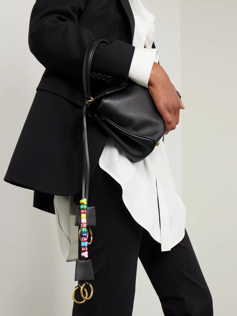 Balenciaga Rodeo Cloche Clé Gold-tone Beaded Leather Keyring, styled view