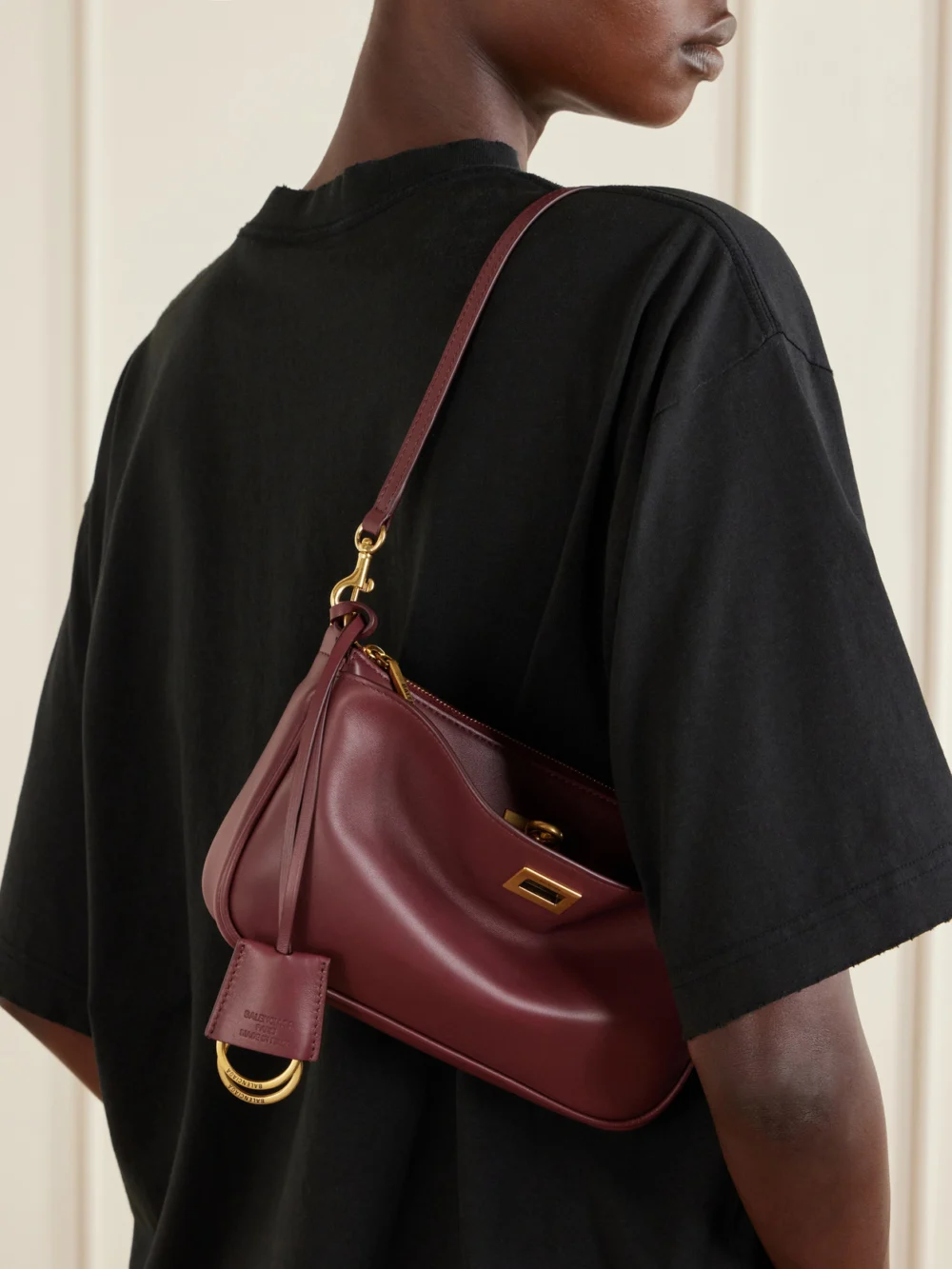 Balenciaga Rodeo Sling Pochette Leather Shoulder Bag, styled view