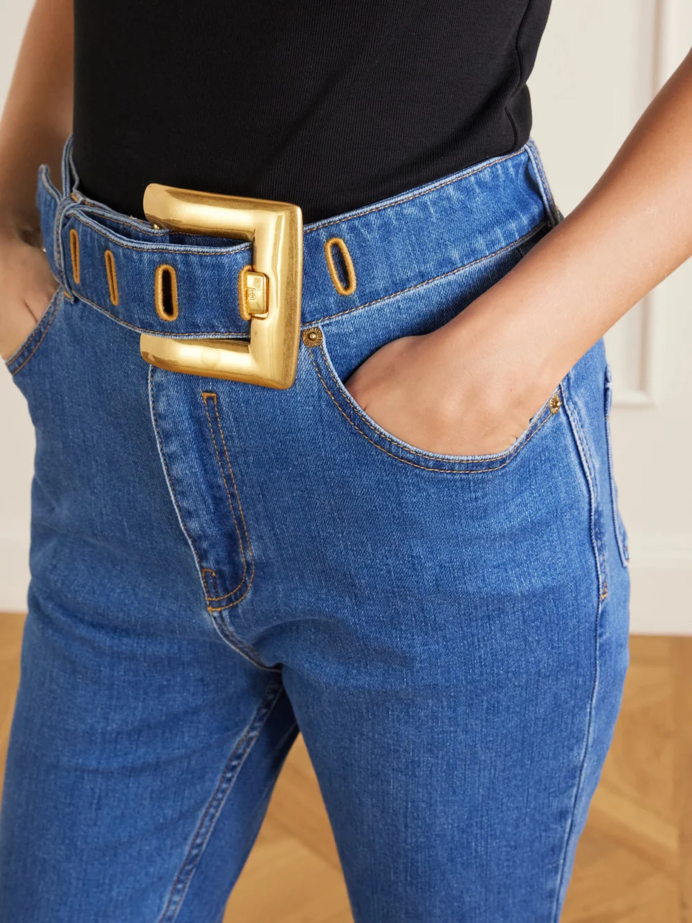 Close-up detail of the Balmain Belted High-waist Straight-leg Jeans