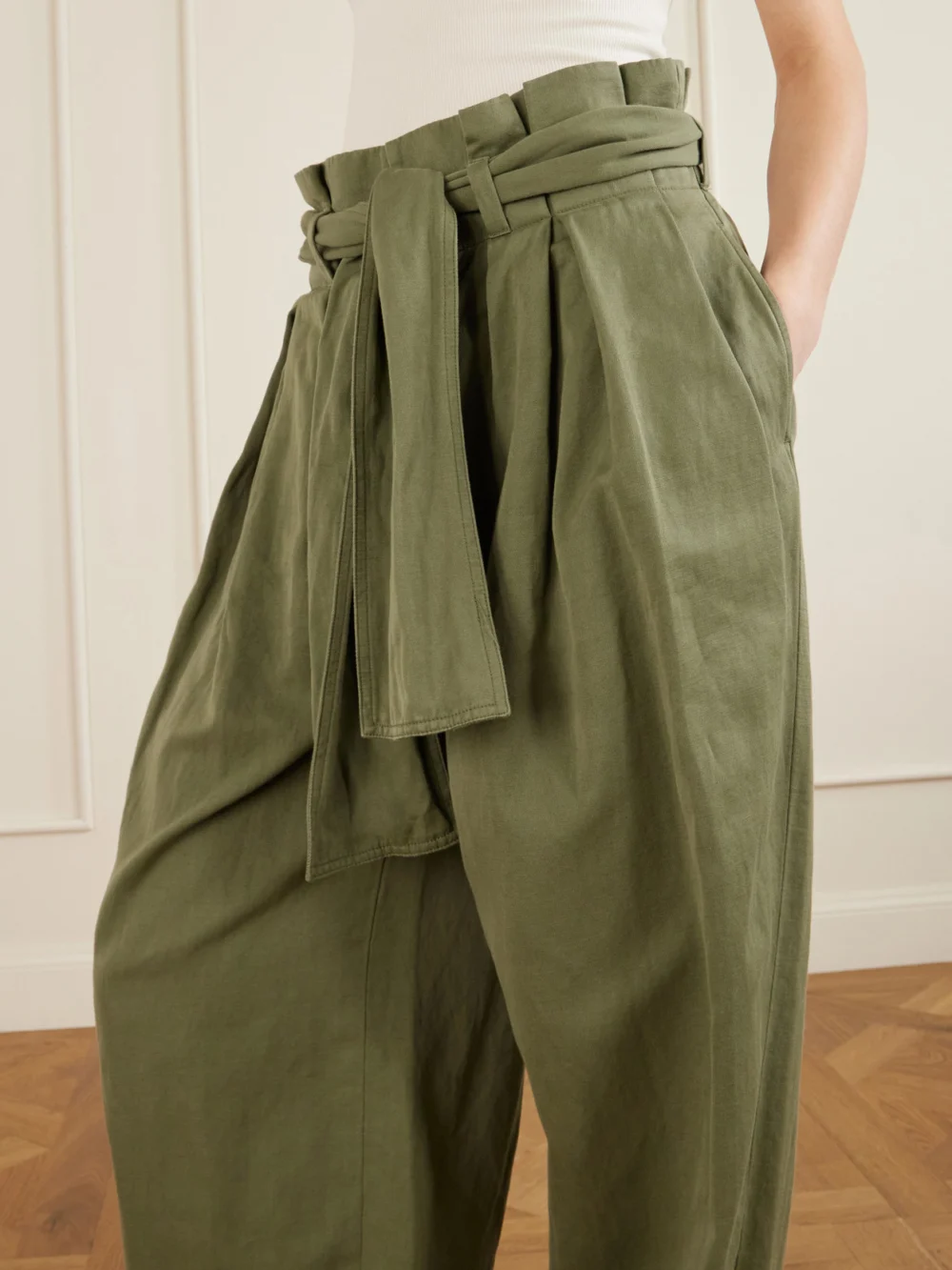 Close-up detail of the Balmain Belted Pleated Cotton and Linen-blend Twill Tapered Pants