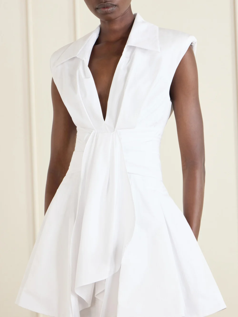 Close-up detail of the Balmain Belted Pleated Cotton-poplin Mini Dress