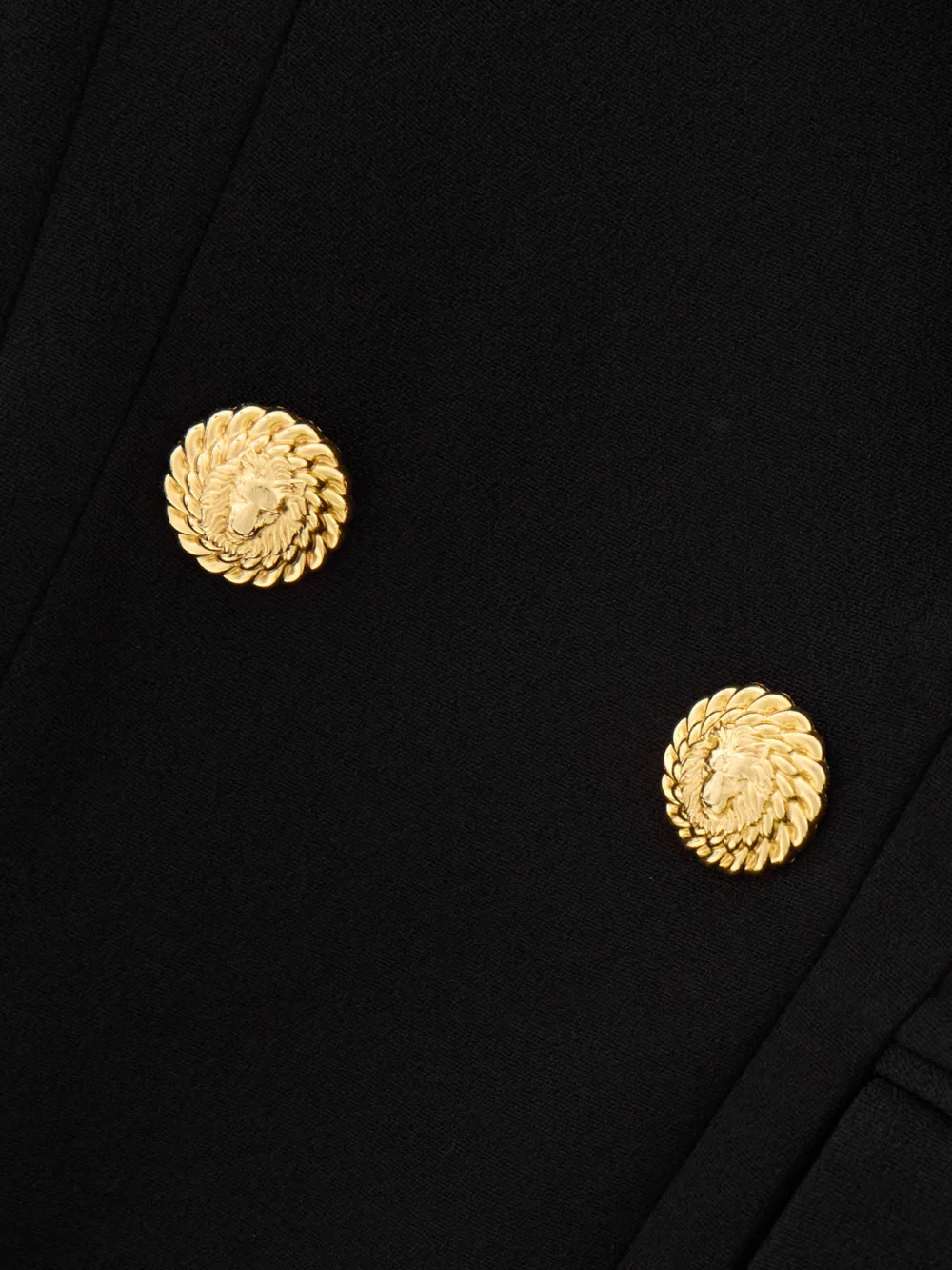 Close-up detail of the Balmain Button-embellished Cotton-twill Mini Dress
