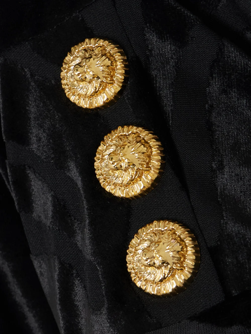 Close-up detail of the Balmain Button-embellished Devoré-velvet Midi Dress