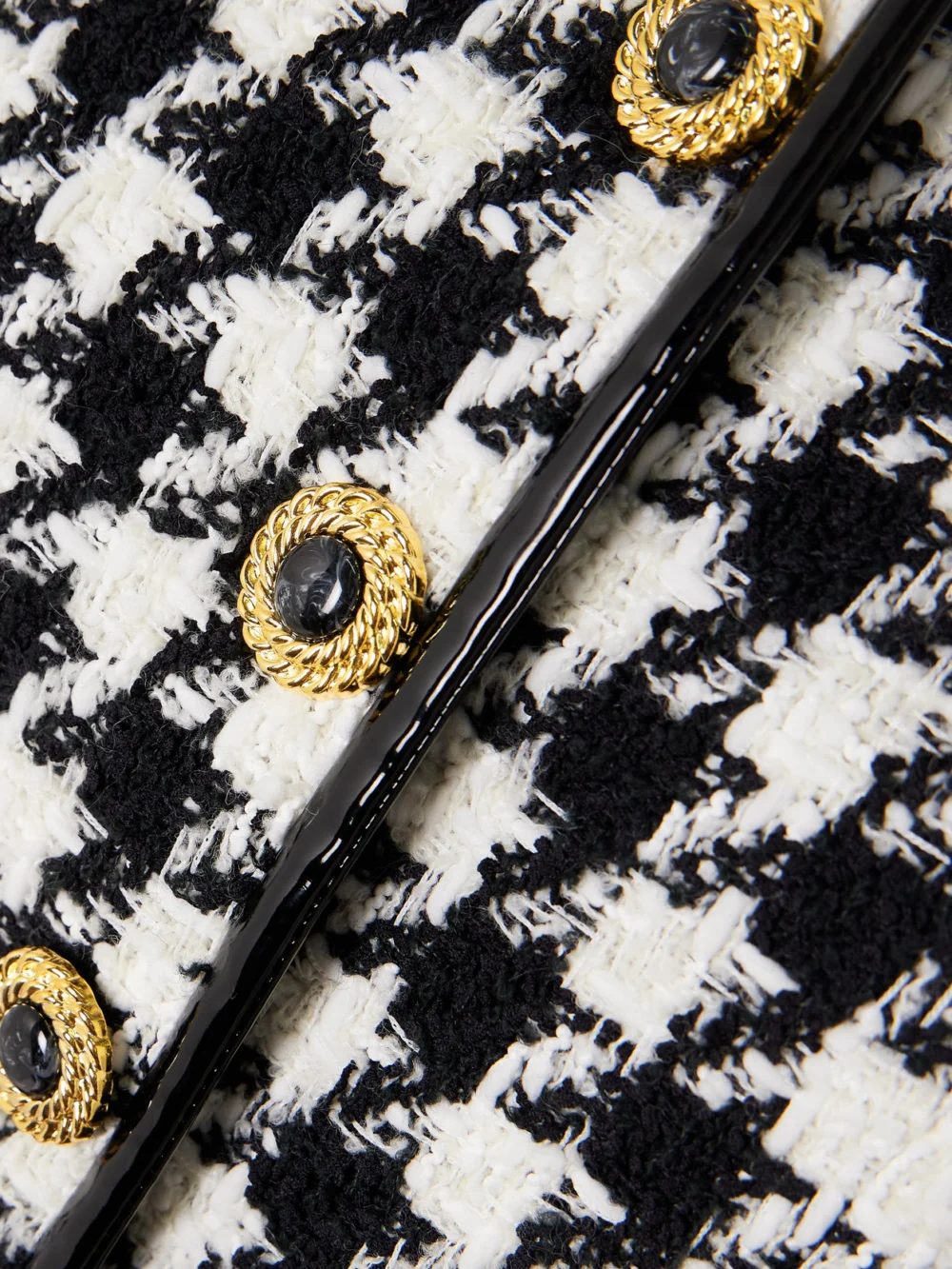 Close-up detail of the Balmain Button-embellished Faux Patent Leather-trimmed Houndstooth Tweed Jacket