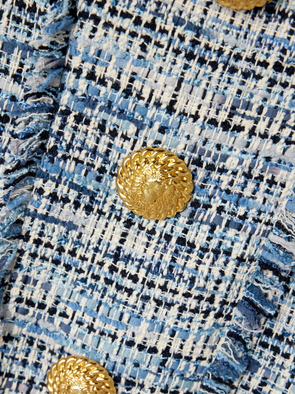Close-up detail of the Balmain Button-embellished Frayed Cotton-blend Tweed Mini Dress