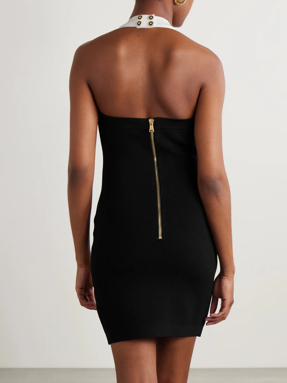 Back view of the Balmain Button-embellished Knitted Halterneck Mini Dress