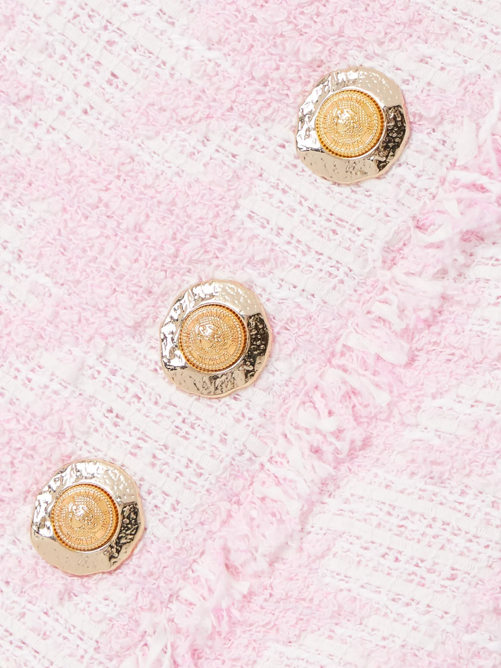 Close-up detail of the Balmain Button-embellished Pleated Checked Cotton-blend Tweed Mini Skirt