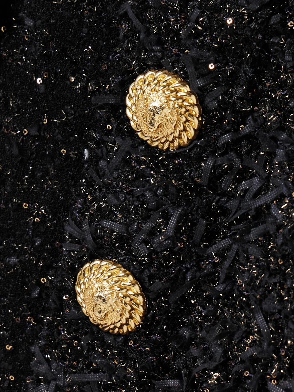 Close-up detail of the Balmain Button-embellished Sequined Metallic Bouclé-tweed Jacket