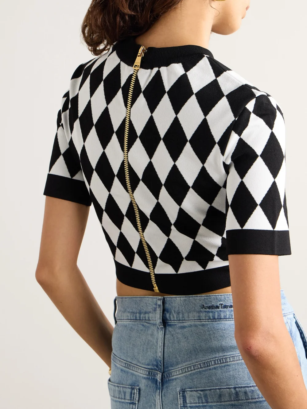 Back view of the Balmain Cropped Button-embellished Jacquard-knit Top