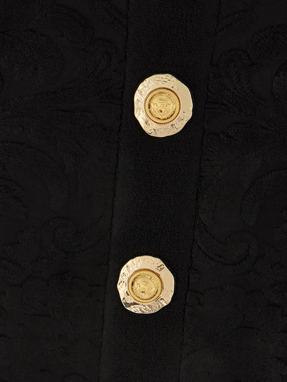 Close-up detail of the Balmain Cropped Button-embellished Jacquard Top