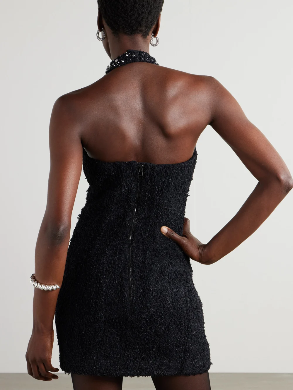 Back view of the Balmain Crystal-embellished Bouclé Halterneck Mini Dress