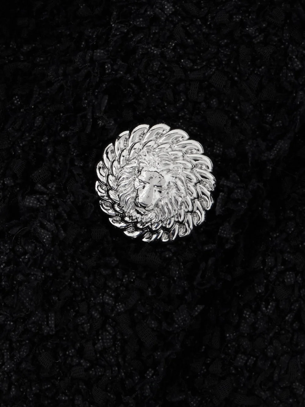 Close-up detail of the Balmain Crystal-embellished Bouclé Halterneck Mini Dress