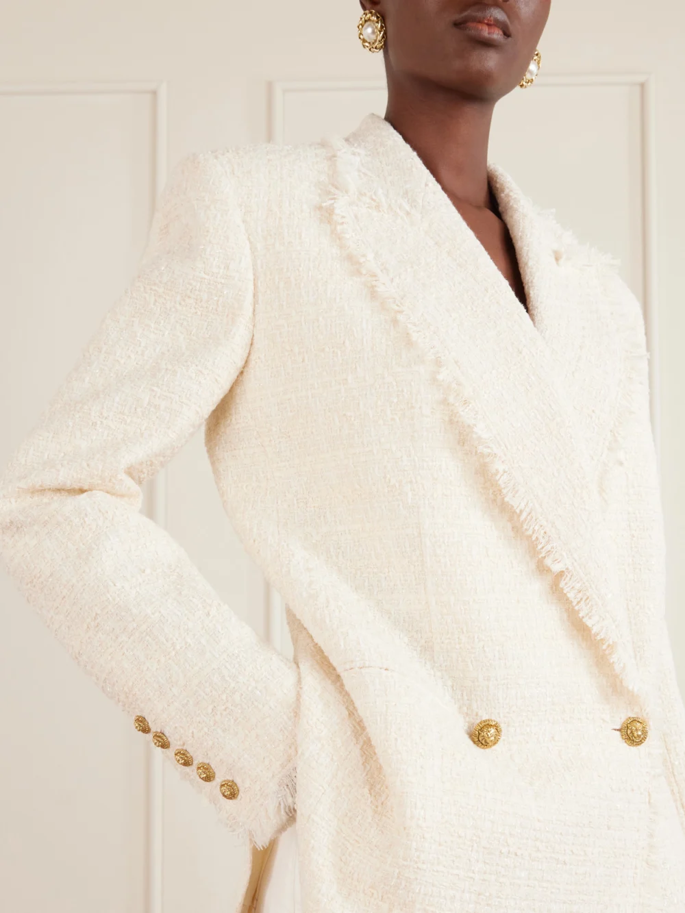 Close-up detail of the Balmain Double-breasted Frayed Wool and Cotton-blend Tweed Blazer