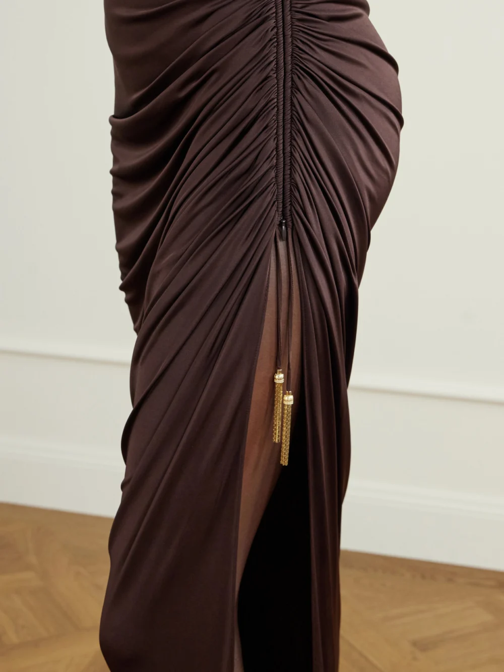 Close-up detail of the Balmain Draped Jersey Turtleneck Maxi Dress